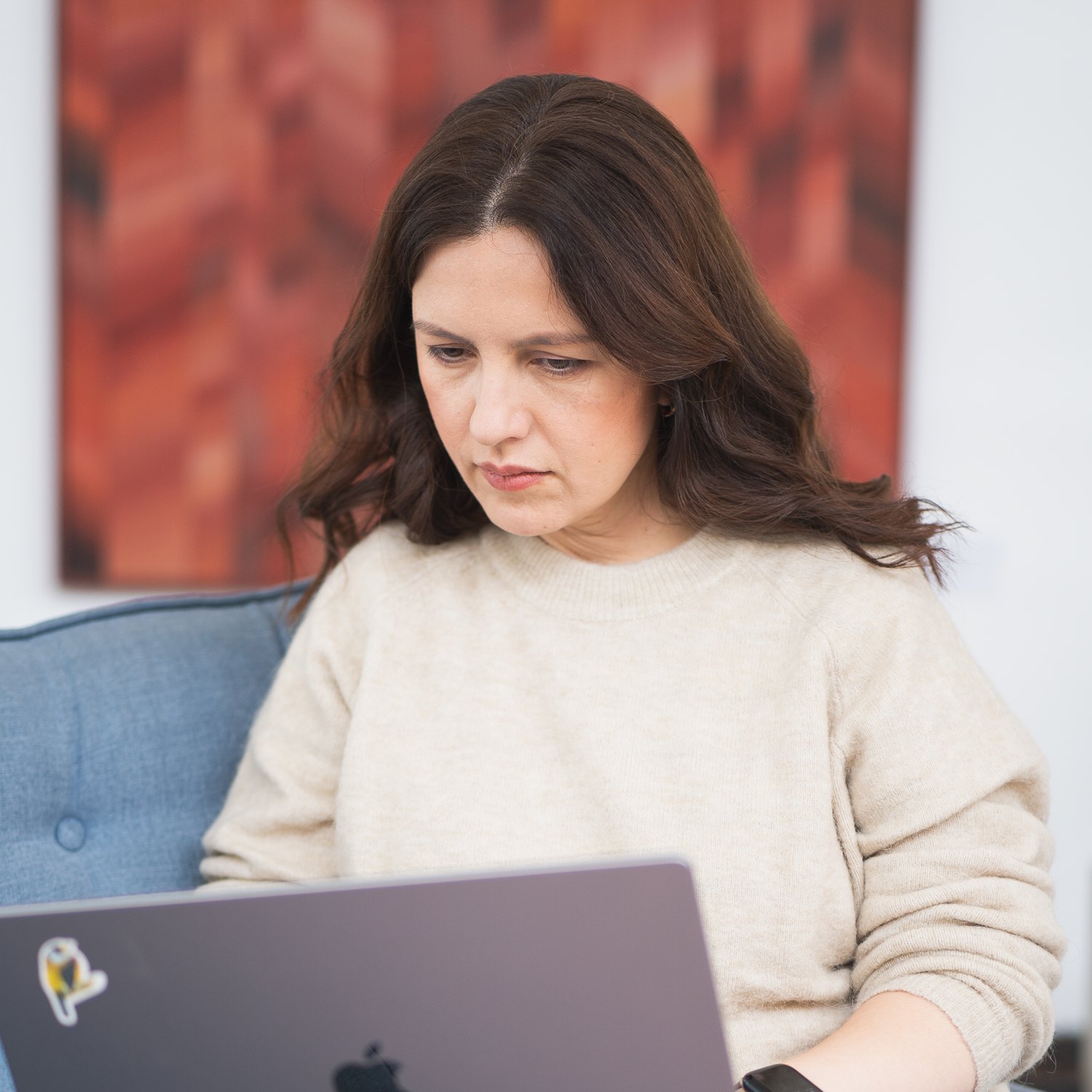 Tatiana working on her laptop, focused
